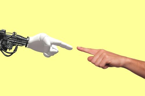 Robot and human hand. Source: Pixabay