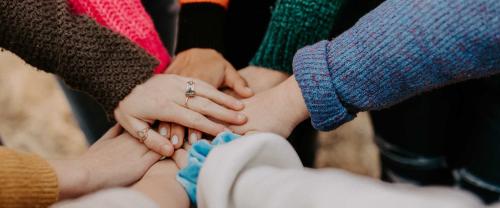 Group with hands together