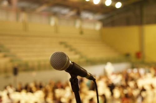 A microphone in an empty conference venue