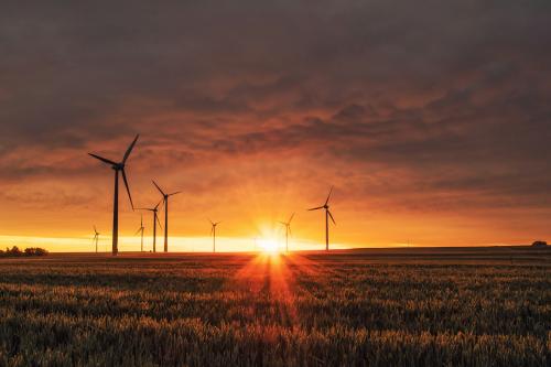 Wind turbines at sunset. Photo by Karsten Würth on Unsplash